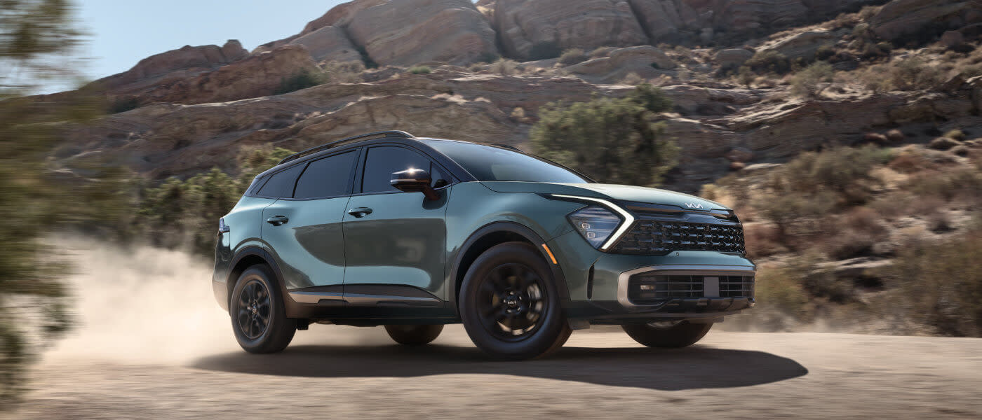 2025 Kia Sportage driving in the desert