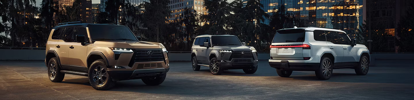 Banner image of three Lexus GX SUVs lined up in the city at night