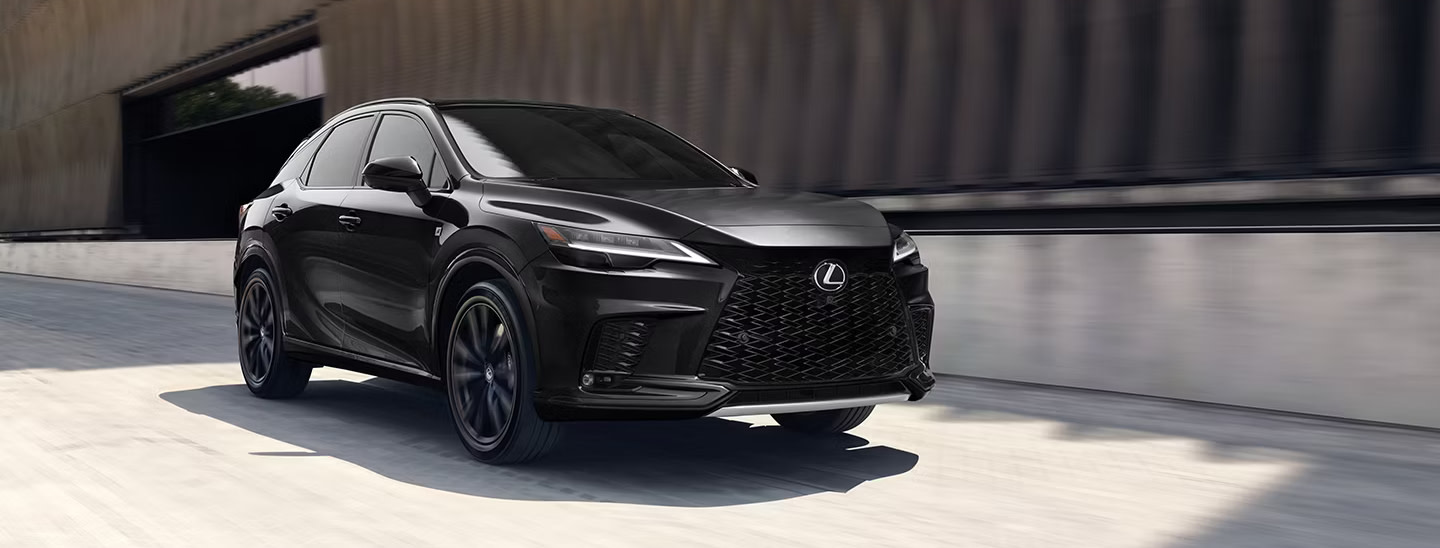 Image of a black 2025 Lexus RX driving