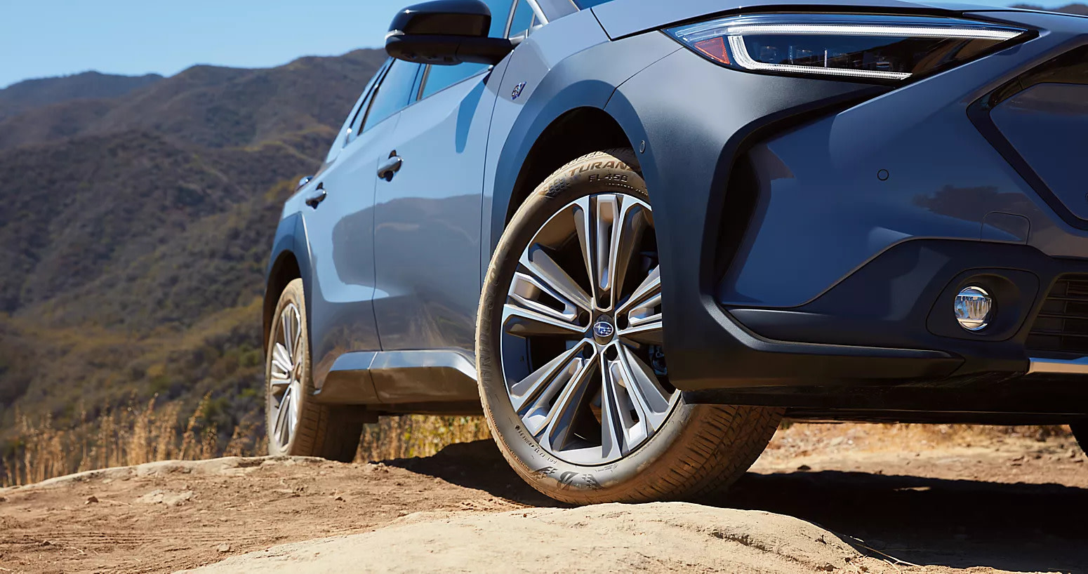 2025 subaru solterra driving over rocky terrain