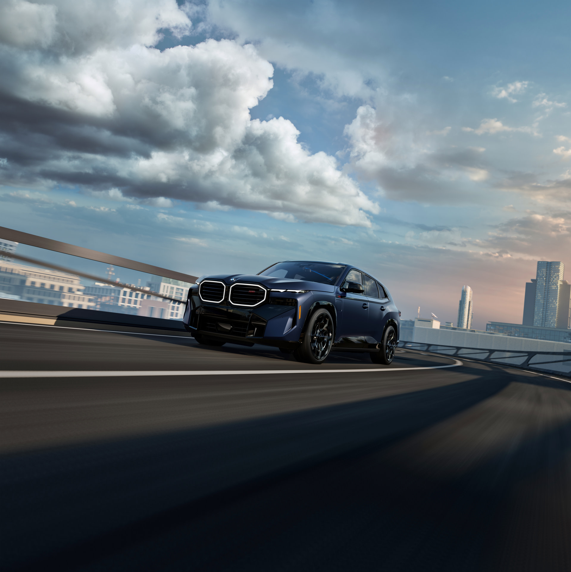 BMW 3 Series driving with mountainous background