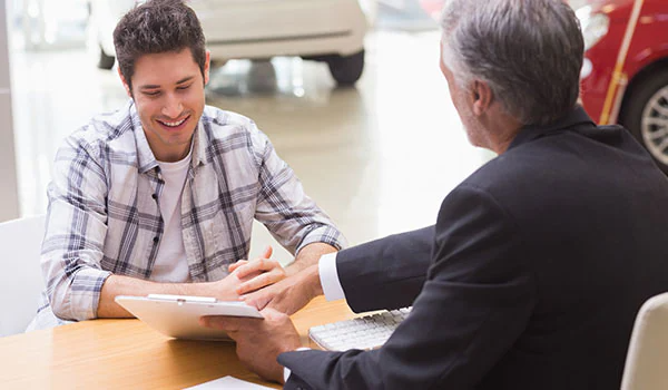 Aged Person Talking to a Young Man