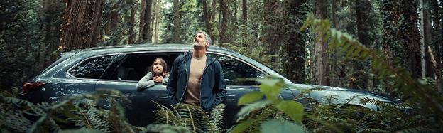 father and daughter in front of the 2020 Mazda CX-9