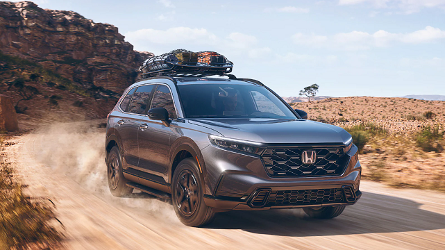 2023 CR-V driving on dirt road with 18-inch wheels