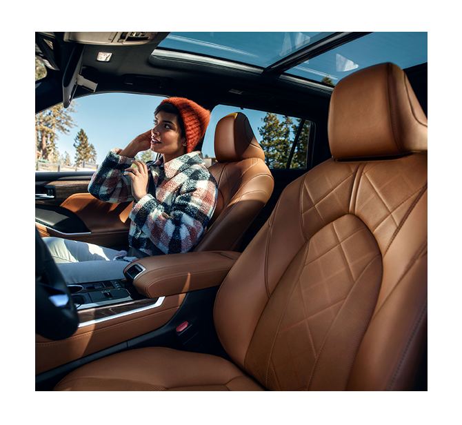 2024 Toyota Highlander vs. 2024 Honda Pilot at Tri County Toyota | Brown leather seats of the interior of a 2024 Toyota Highlander 