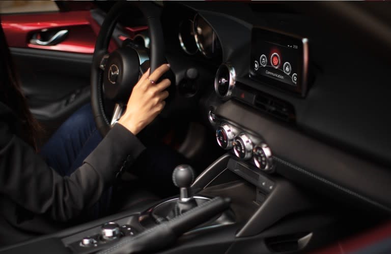 person sitting in the interior of the 2020&nbsp;Mazda Miata