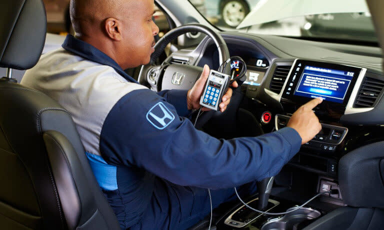 Mechanic Testing Infotainment System