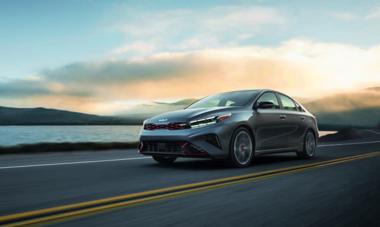 2024 Kia Forte driving fast seaside