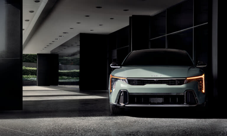 2025 Kia K4 parked by a building