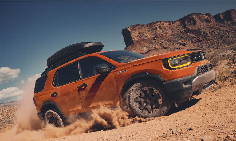 2026 Honda Passport offroading with clamshell carrier