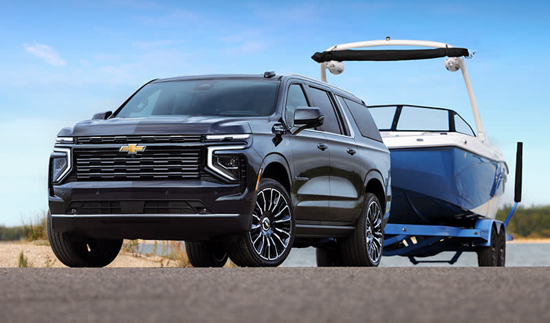2025 Chevrolet Suburban towing a boat
